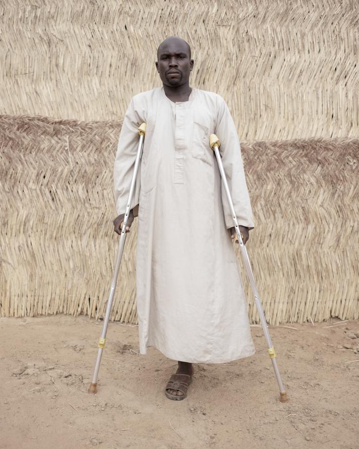 Mohamad Isaac standing in front of EU-funded HI centre in Aboutengue: after his leg was amputated, he fell into a deep depression. 