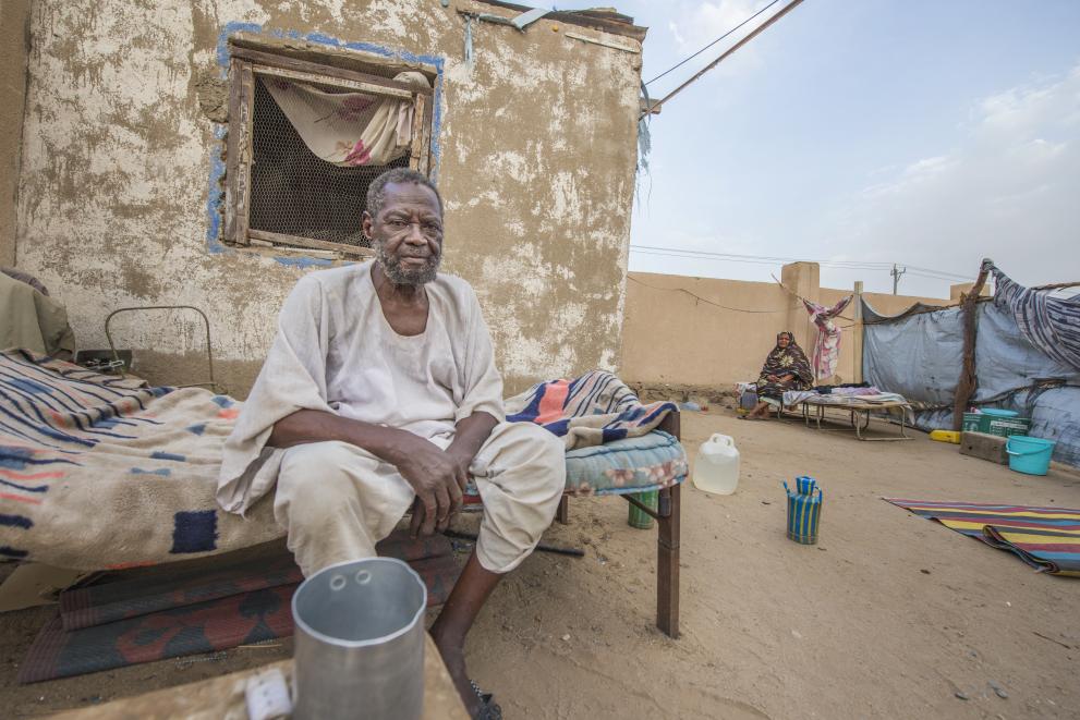 Mohammed Khater Mahmoud outside his shelter in a Port Sudan displacement camp.